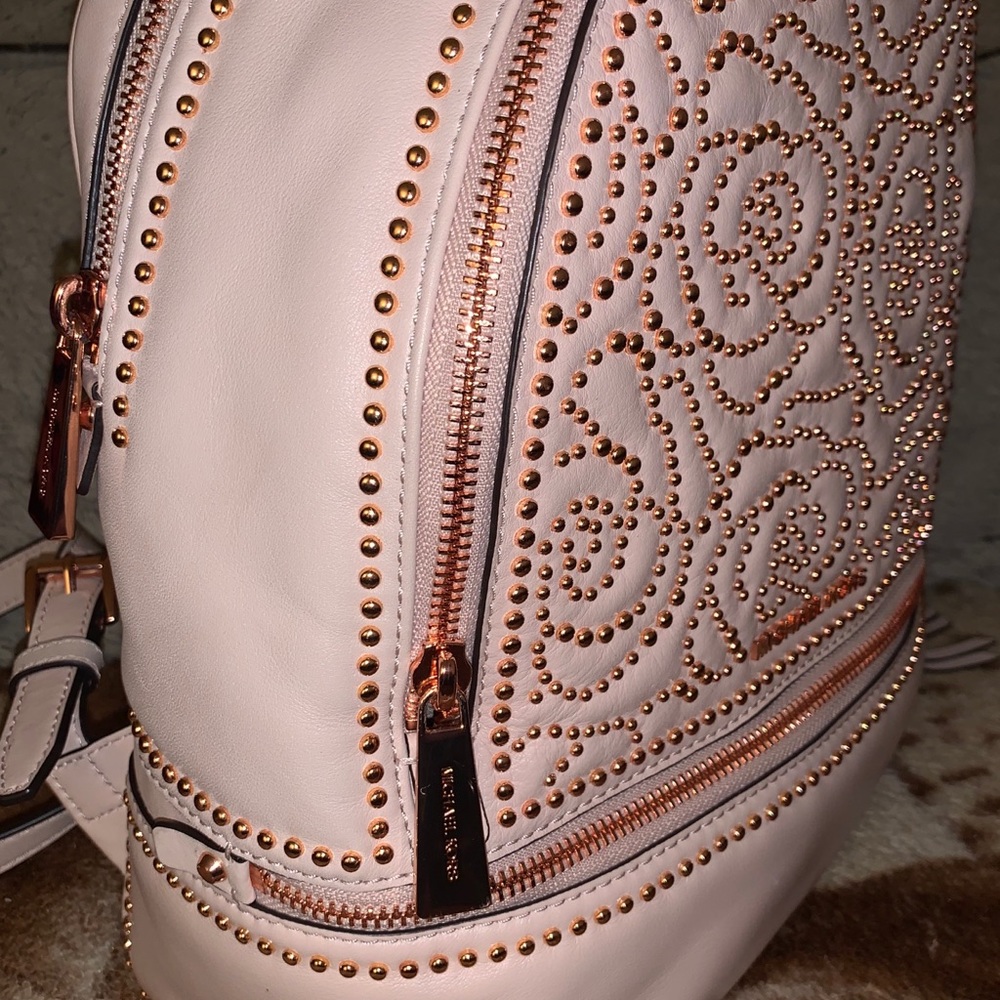 Michael Kors “Rhea Studded” backpack